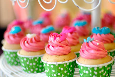 cute and colorful yummy cupcakes tierの写真素材