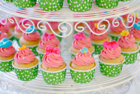 cute and colorful yummy cupcakes tierの写真素材