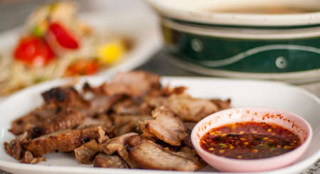 thai spicy food, griil pork and papaya saladの写真素材