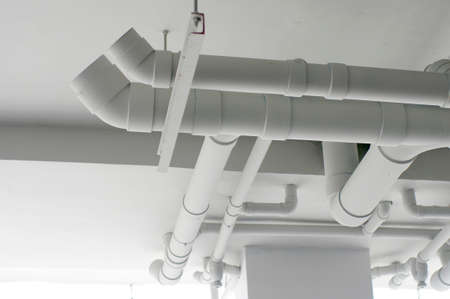 white pipes system on the ceilingの写真素材
