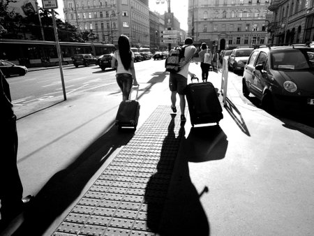tourist in europe carry luggage on paving street black and whiteのeditorial素材
