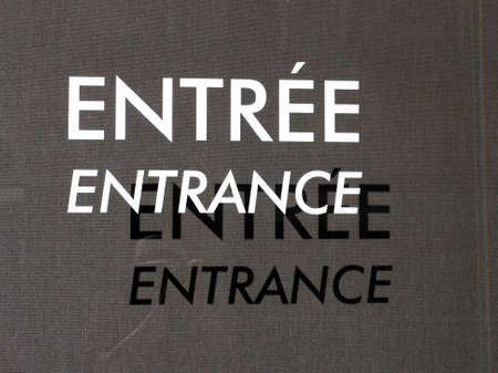 entrance, entree sign on glass with shadowの写真素材