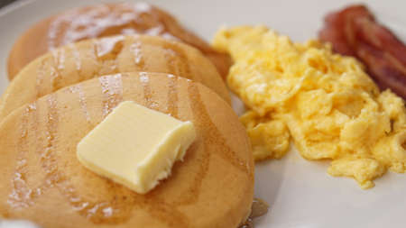 omelette bacon pancake with butter american style breakfastの写真素材
