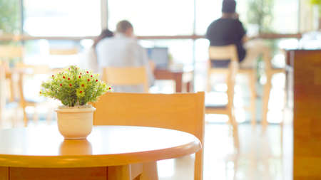 working in coffee shop blur people background with copy spaceの写真素材