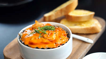 spicy scallop with mayo cream together with garlic breadの写真素材