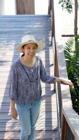 asian girl in holiday with straw hatの写真素材
