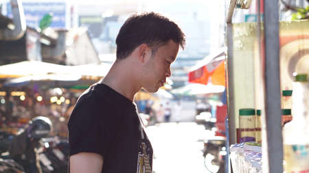 asian guy at local marketの写真素材