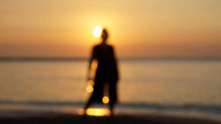 Blur woman silhouette in front of morning sunlight abstract starting new day, new life