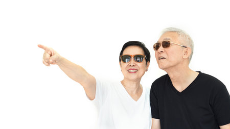 Asian senior couple pointing white isolate backgroundの写真素材