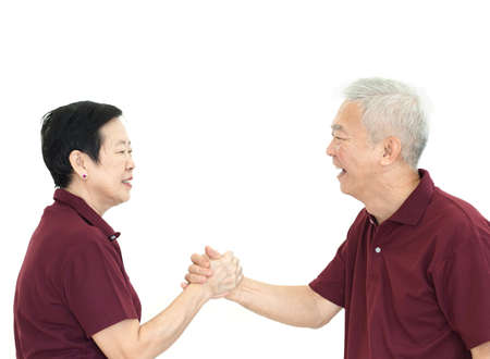 happy asian senior couple holding hands white isolate background