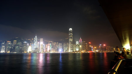 Hong Kong - April 2016: Skyscrapers of Hong Kong. World famous skyline at night with tourist visiting and taking photoのeditorial素材