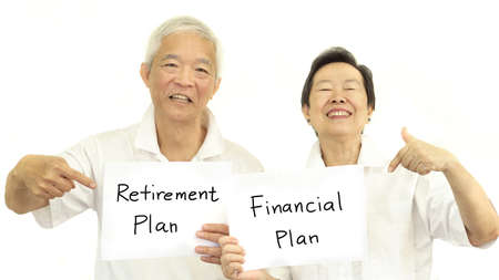 Happy Asian senior couple with sign retirment plan and financial planの写真素材