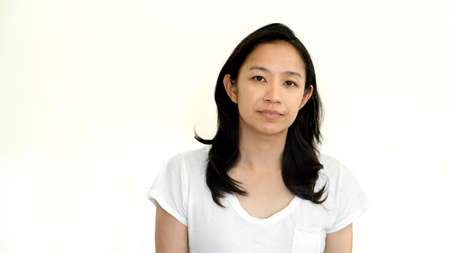 Casual asian girl on white background smiling face with relax tee shirtの写真素材