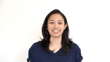 Casual asian girl on white background smiling face with relax tee shirtの写真素材