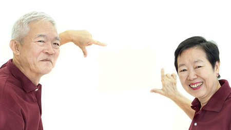 Asian senior couple frame up copy space white isolate backgroundの写真素材