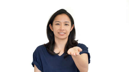 South East Asian girl doing presentation hand gesture with  copy spaceの写真素材
