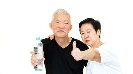 Asian Senior couple water bottle stay dydrate for healthの写真素材