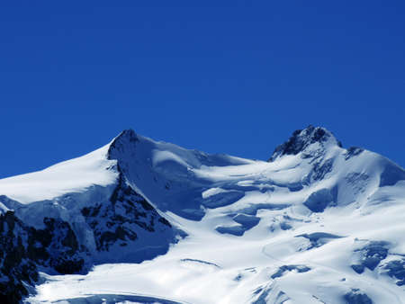 Snow peak mountain scenic view of Europe alphine in summer clear skyの写真素材