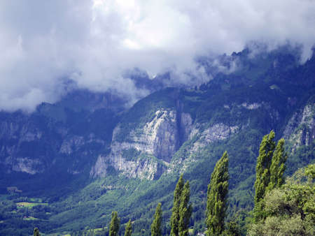 Beautiful majestic view from road trip in Europe. Mountain alp landscape with forestの写真素材