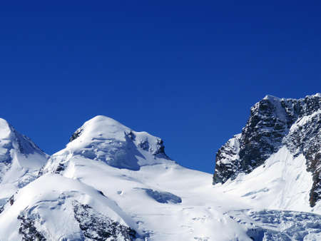 Snow peak mountain scenic view of Europe alphine in summer clear skyの写真素材