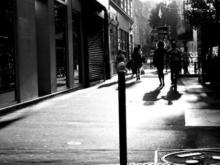 people walking on street of Paris black and whiteの写真素材