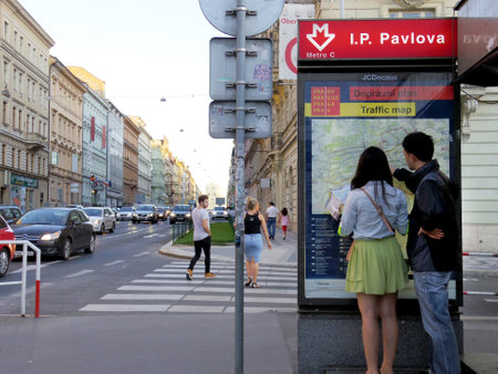 Prague, Czech Republic - July 2015: Asian tourists looking at map in the cityのeditorial素材