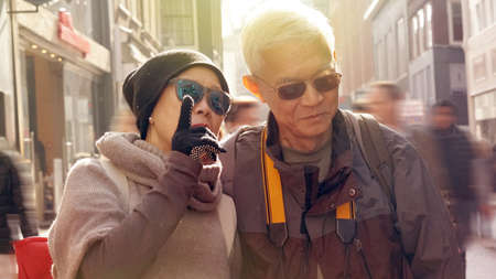 Asian senior couple having fun in Europe retirement anniversary tripの写真素材