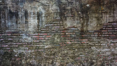 Old rustic brick and cracked plaster texture backgroundの写真素材