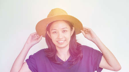 Casual Asian girl wearing straw hat summer fun. Relax and happy expressionの写真素材