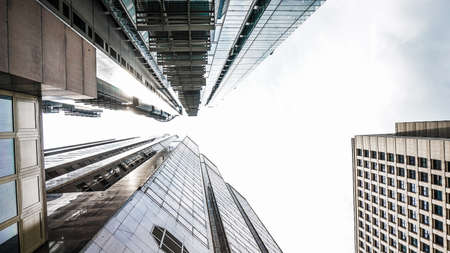 Modern glass buildings from low angle with sky shot. Concept world finance and eastate businessの写真素材