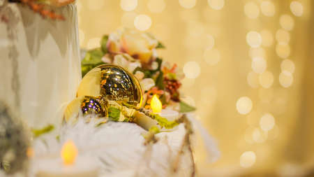 Gold Christmas ornaments with blur bokeh light copy scape backgroundの写真素材