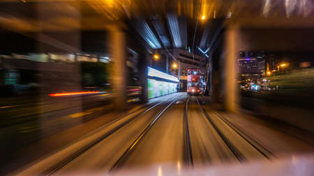 Hong Kong Central buisness district area night view from moving tram transportationの写真素材