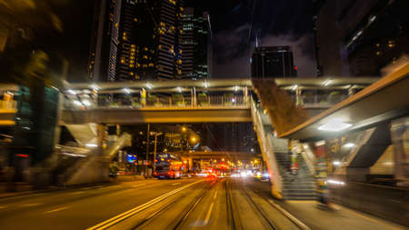 Hong Kong Central buisness district area night view from moving tram transportationの写真素材