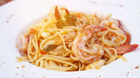 Spaghetti spicy olive oil and seafood prawnの写真素材