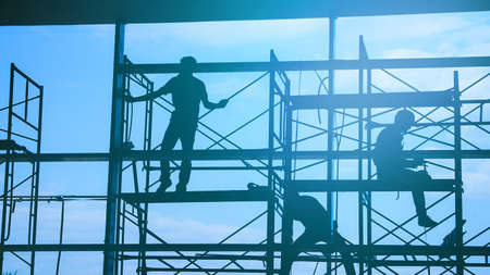 Woker silhouette on scaffold contruction safty working businessの写真素材