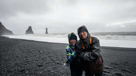 Iceland senior couple tourist at black beachの写真素材