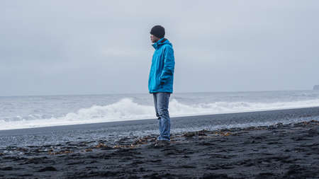 Asina advanture man  at Iceland black beach copy spaceの写真素材