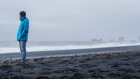 Asina advanture man  at Iceland black beach copy spaceの写真素材
