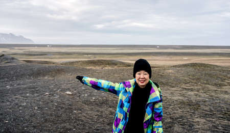 Asian senior woman travel to Iceland have fun after retirementの写真素材