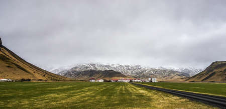 Iceland green landscape moss with mountain and clody skyの写真素材
