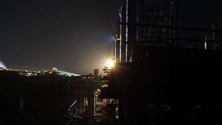 Construction at night structure with light building cityの写真素材