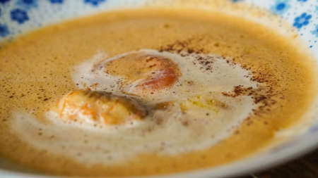 Bowl of creamy delicious lobster soupの写真素材