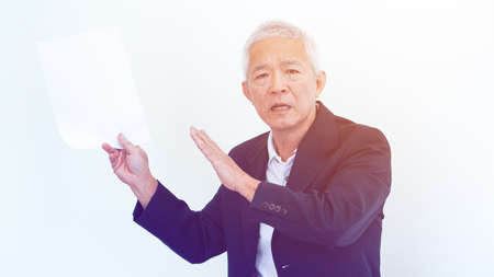 Asian senior businessman unhappy angry expression for result copy spaceの写真素材