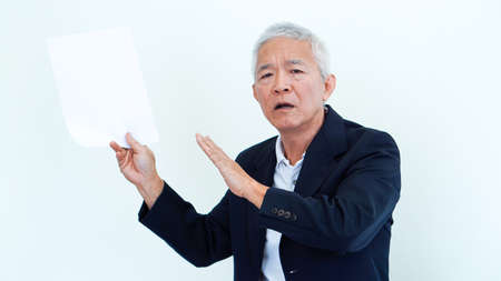 Asian senior businessman unhappy angry expression for result copy spaceの写真素材