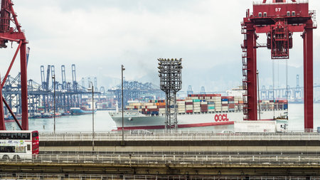 Hong Kong - 23 April 2016 : Cargo and crane shipment dock. World main transportation portのeditorial素材