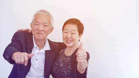 Happy smile Asian elderly couple in business attire, SME family ownerの写真素材