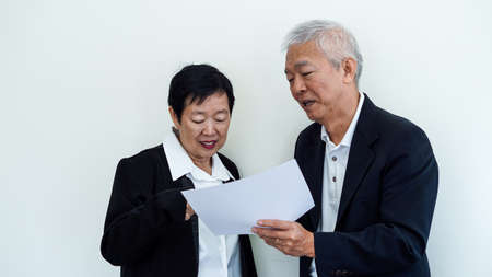 Happy smile Asian elderly couple in business attire, SME family ownerの写真素材