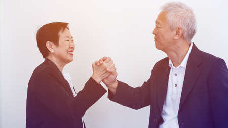 Happy smile Asian elderly couple in business attire, SME family ownerの写真素材