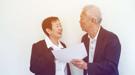 Happy smile Asian elderly couple in business attire, SME family ownerの写真素材