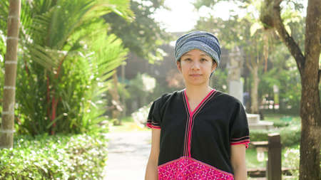 Asian ethnic woman with native dress smile at her mornign organic rice fieldの写真素材